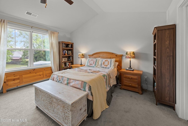 carpeted bedroom featuring lofted ceiling and ceiling fan