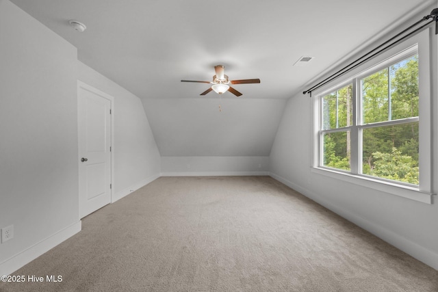 104 Two Sisters Ter, Sneads Ferry, NC 28460 - additional living space with a ceiling fan, light colored carpet, vaulted ceiling, and baseboards