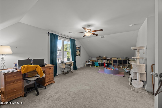 office space with lofted ceiling, a ceiling fan, and carpet flooring