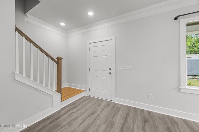 104 Two Sisters Ter, Sneads Ferry, NC 28460 - entryway featuring crown molding, wood finished floors, stairs, baseboards, and recessed lighting