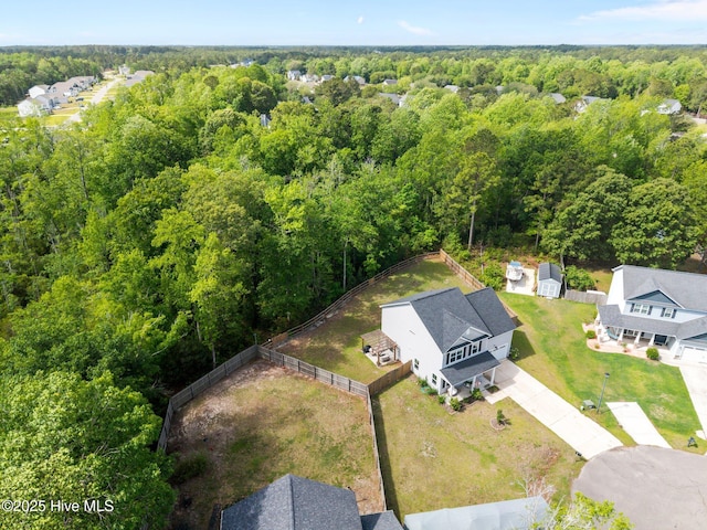 drone / aerial view of a heavily wooded area