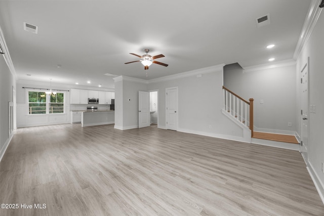 104 Two Sisters Ter, Sneads Ferry, NC 28460 - unfurnished living room with crown molding, recessed lighting, a ceiling fan, stairs, and baseboards