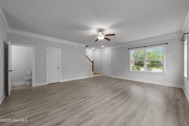 104 Two Sisters Ter, Sneads Ferry, NC 28460 - unfurnished living room featuring stairs, a ceiling fan, light wood finished floors, ornamental molding, and baseboards