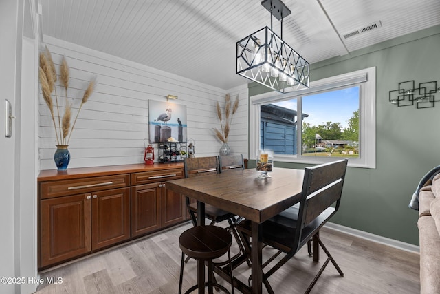 2 Harbour Walk, New Bern, NC 28562 - dining area featuring light wood finished floors, baseboards, and wood walls