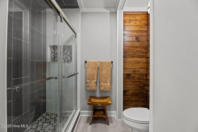 2 Harbour Walk, New Bern, NC 28562 - bathroom with toilet, a shower stall, wood finished floors, and baseboards