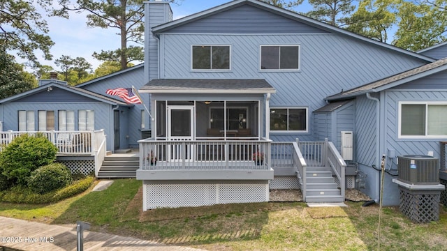 2 Harbour Walk, New Bern, NC 28562 - back of house with a sunroom, a chimney, central air condition unit, and a wooden deck