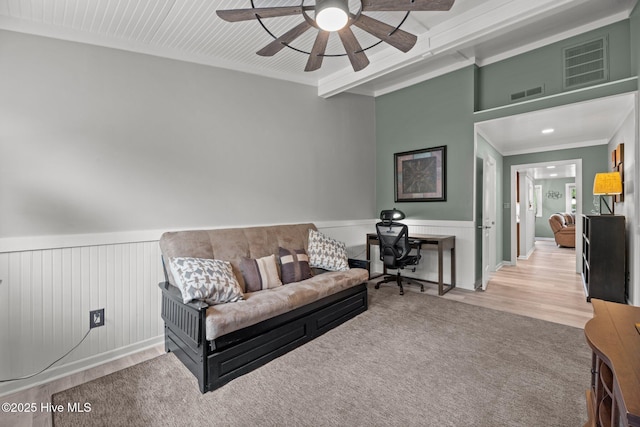 2 Harbour Walk, New Bern, NC 28562 - living area with a ceiling fan, a wainscoted wall, crown molding, and wood finished floors