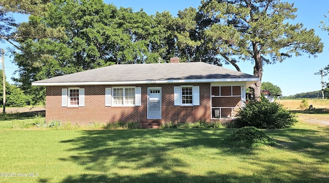1122 Zion Church Rd, Conway, NC 27820 - view of front of property with entry steps, a front lawn, a chimney, and brick siding