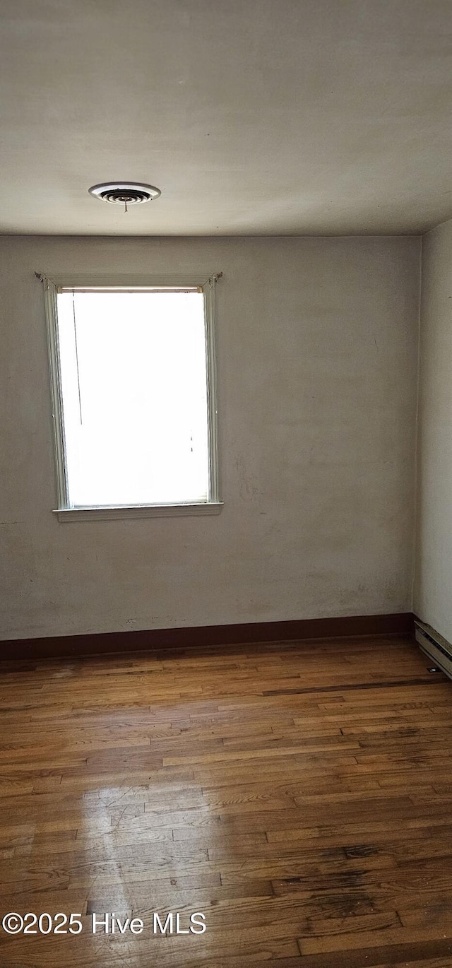 1122 Zion Church Rd, Conway, NC 27820 - empty room featuring dark wood finished floors and baseboards