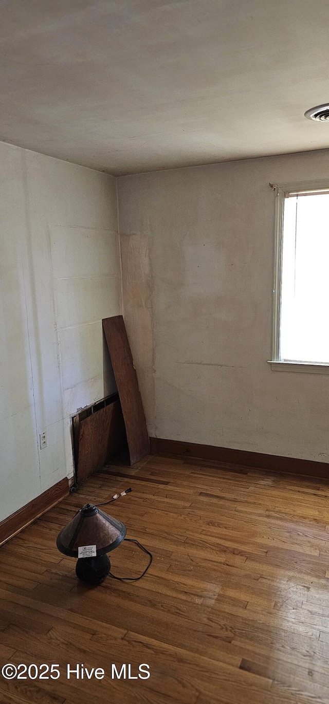 1122 Zion Church Rd, Conway, NC 27820 - empty room with wood finished floors and baseboards