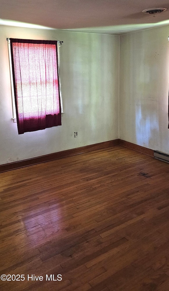 1122 Zion Church Rd, Conway, NC 27820 - unfurnished room with wood finished floors and baseboards