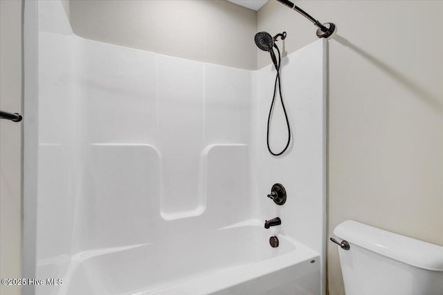 bathroom featuring toilet and shower / washtub combination