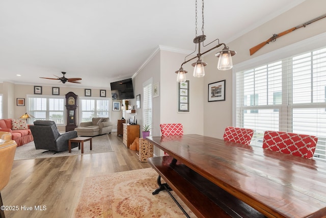 139 Sound Point Dr, Harkers Island, NC 28531 - dining area with light wood-style flooring, crown molding, a ceiling fan, and recessed lighting