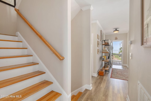 139 Sound Point Dr, Harkers Island, NC 28531 - stairs with wood finished floors, crown molding, and baseboards