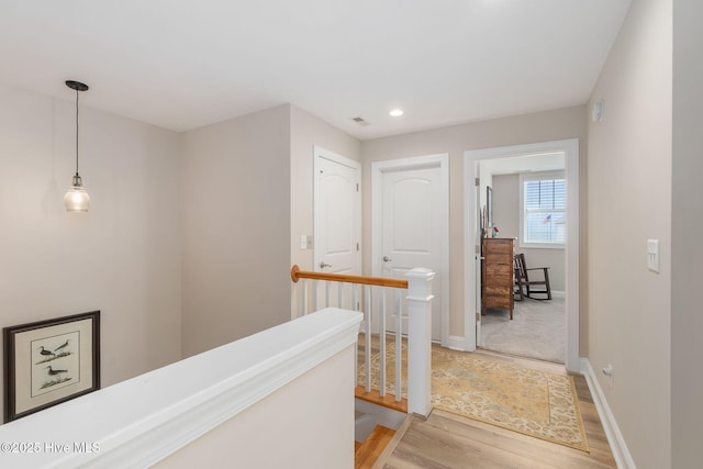 139 Sound Point Dr, Harkers Island, NC 28531 - hallway featuring an upstairs landing, light wood finished floors, baseboards, and recessed lighting