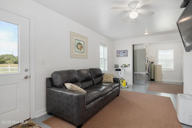 139 Sound Point Dr, Harkers Island, NC 28531 - living room featuring plenty of natural light, ceiling fan, and baseboards