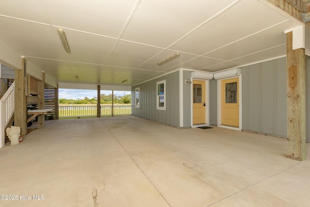 139 Sound Point Dr, Harkers Island, NC 28531 - unfurnished living room with concrete flooring