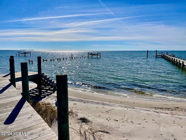 139 Sound Point Dr, Harkers Island, NC 28531 - dock area featuring view of water and beach