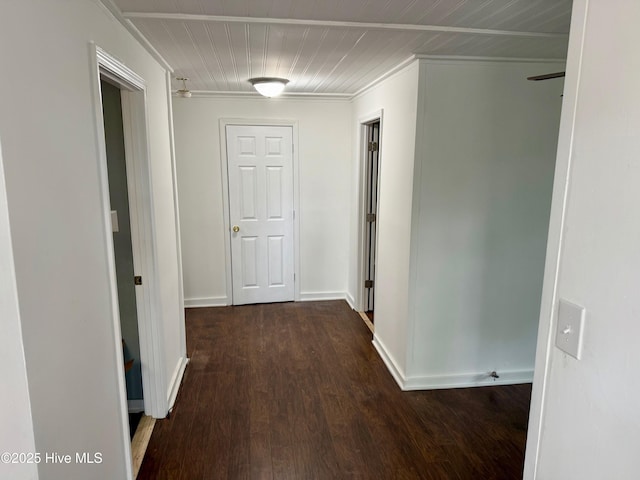 hallway with baseboards and wood finished floors