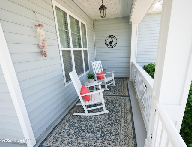 6959 Gracieuse Ln SW, Ocean Isle Beach, NC 28469 - balcony featuring a porch