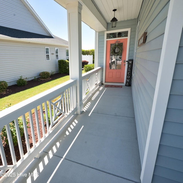 6959 Gracieuse Ln SW, Ocean Isle Beach, NC 28469 - doorway to property featuring a porch