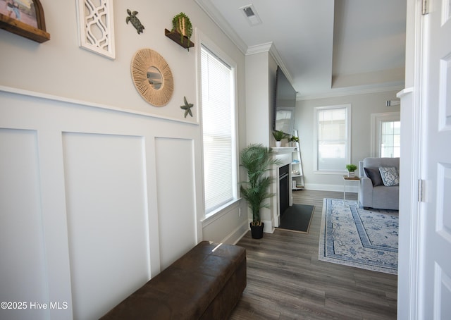 6959 Gracieuse Ln SW, Ocean Isle Beach, NC 28469 - living room with ornamental molding, dark wood-type flooring, healthy amount of natural light, a fireplace with flush hearth, and baseboards