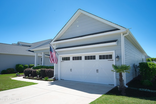 6959 Gracieuse Ln SW, Ocean Isle Beach, NC 28469 - view of front of property with a garage and driveway