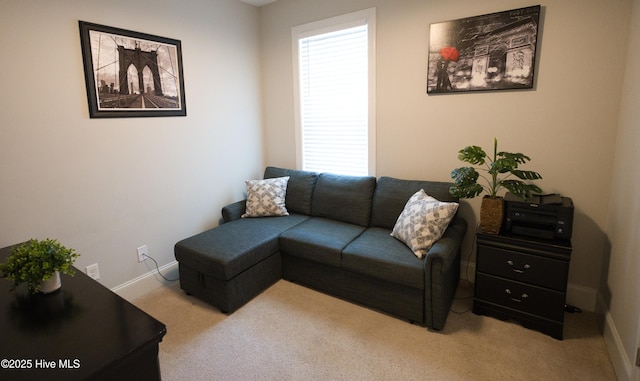 6959 Gracieuse Ln SW, Ocean Isle Beach, NC 28469 - carpeted living room featuring baseboards