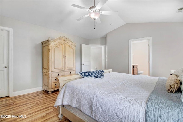bedroom with ensuite bathroom, baseboards, ceiling fan, light wood-style floors, and lofted ceiling