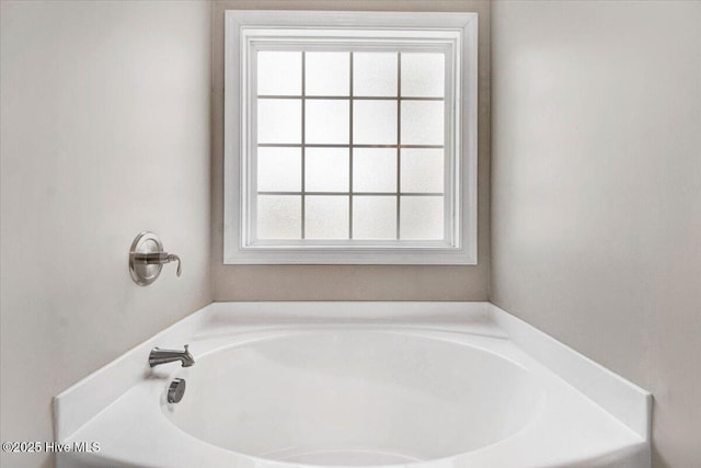 bathroom featuring a garden tub