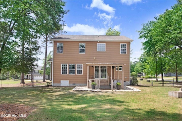 rear view of property featuring a yard, fence private yard, and crawl space