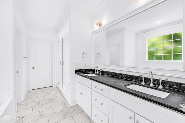 bathroom with a shower stall, marble look tile flooring, crown molding, and double vanity