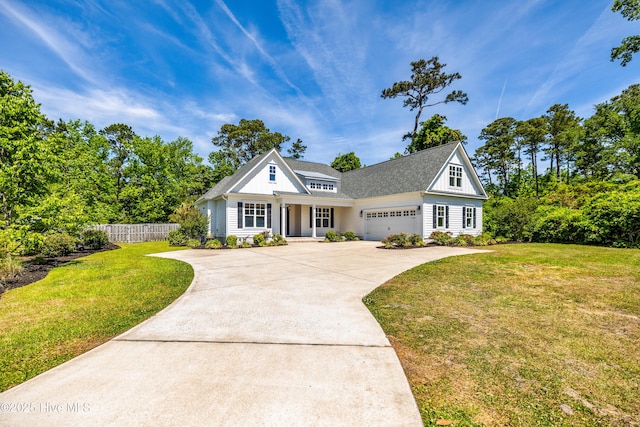 view of front of house with driveway, an attached garage, covered porch, and roof with shingles
