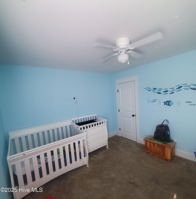 bedroom featuring carpet and baseboards