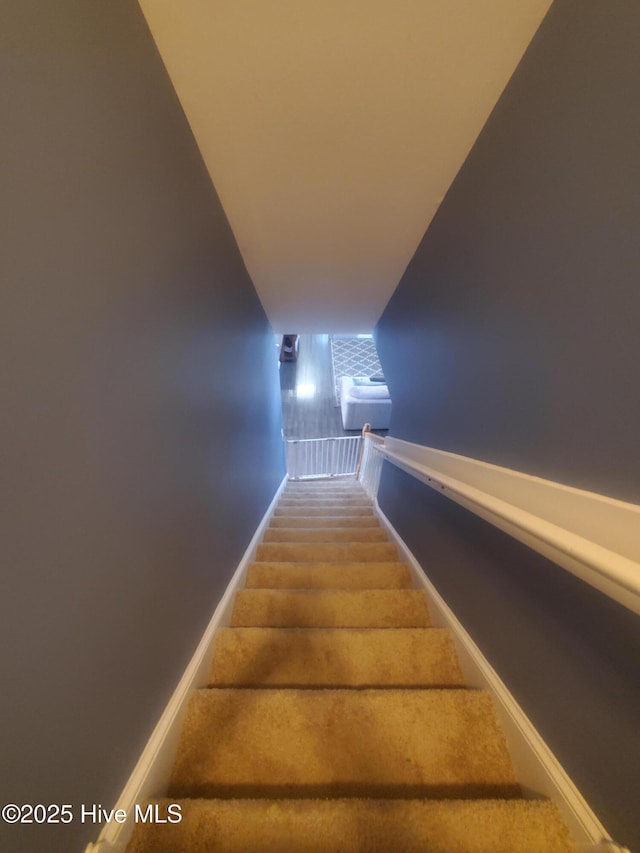 stairs featuring baseboards