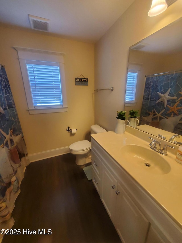 full bathroom with vanity, toilet, wood finished floors, baseboards, and a shower with curtain