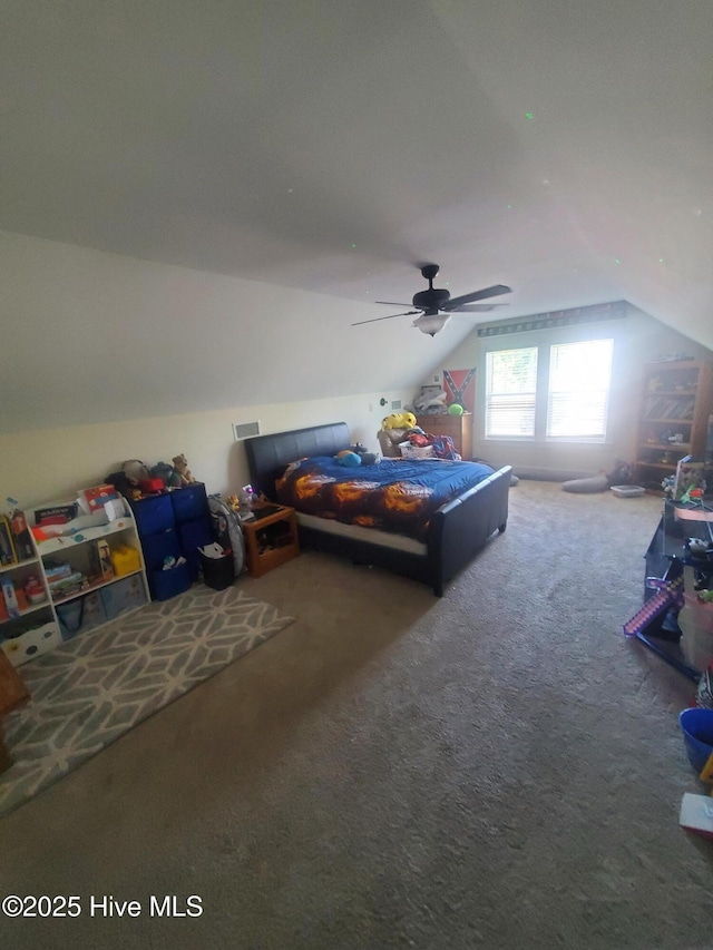 bedroom featuring lofted ceiling, carpet flooring, and a ceiling fan