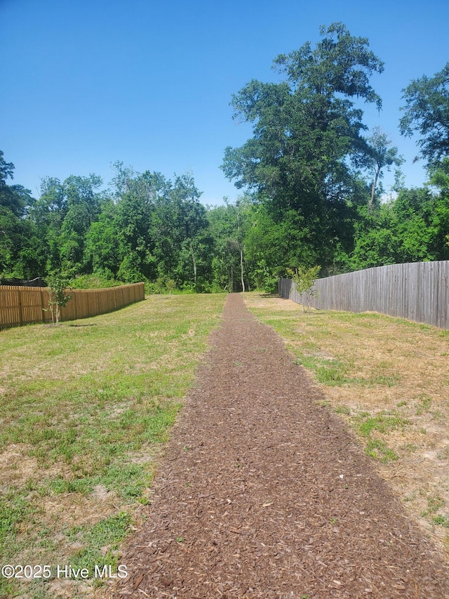 view of yard featuring fence