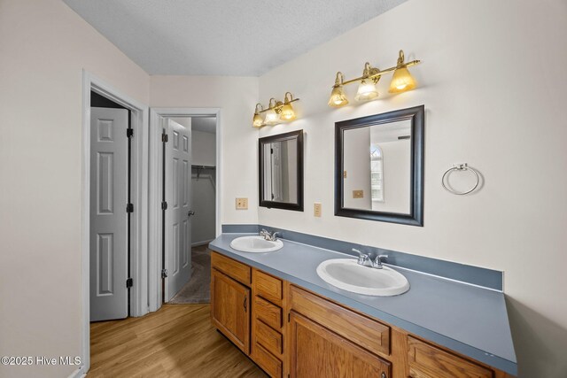 123 W Victoria Ct Unit F, Greenville, NC 27834 - bathroom featuring double vanity and wood finished floors