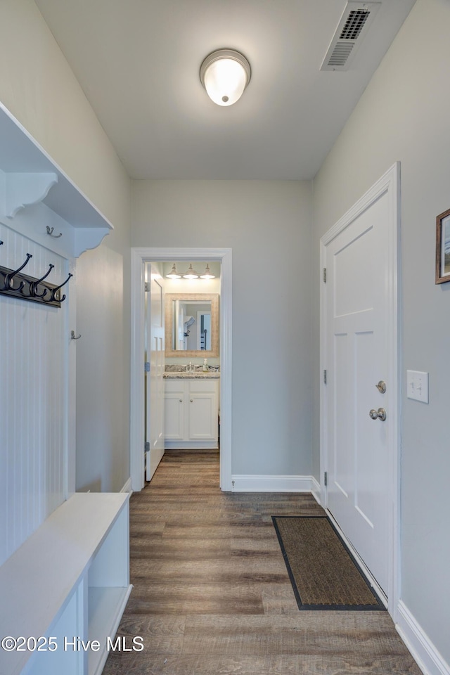 519 W Craftsman Way, Hampstead, NC 28443 - mudroom featuring dark wood-style flooring, baseboards, and a sink