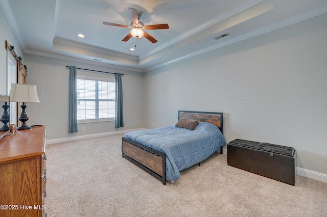 519 W Craftsman Way, Hampstead, NC 28443 - carpeted bedroom with a tray ceiling, crown molding, a barn door, baseboards, and recessed lighting
