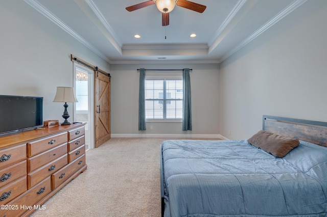 519 W Craftsman Way, Hampstead, NC 28443 - bedroom with light colored carpet, a tray ceiling, a barn door, crown molding, and a ceiling fan