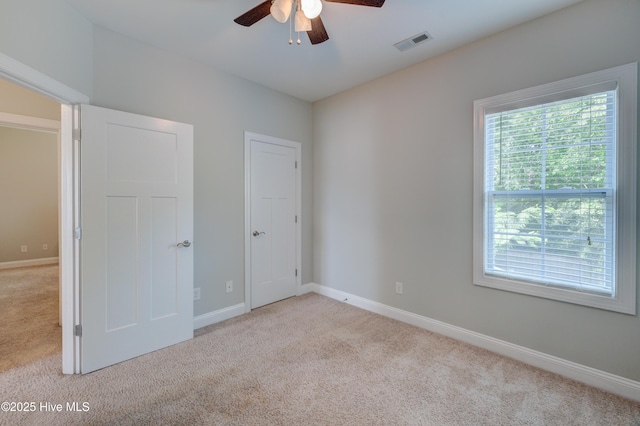 519 W Craftsman Way, Hampstead, NC 28443 - unfurnished bedroom with carpet floors, baseboards, and a ceiling fan