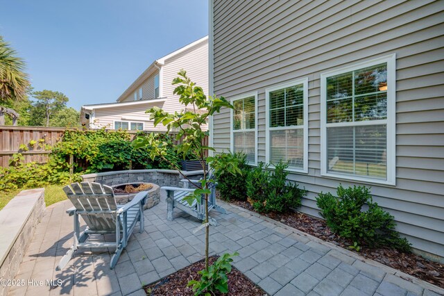 519 W Craftsman Way, Hampstead, NC 28443 - view of patio featuring an outdoor fire pit