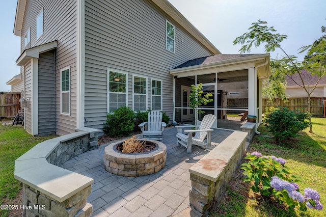 519 W Craftsman Way, Hampstead, NC 28443 - view of patio featuring a sunroom and an outdoor fire pit
