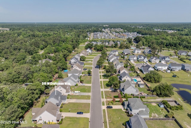 519 W Craftsman Way, Hampstead, NC 28443 - aerial view of property and surrounding area with nearby suburban area and a heavily wooded area