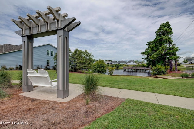 519 W Craftsman Way, Hampstead, NC 28443 - view of grassy yard featuring a water view and a patio