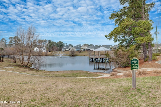 519 W Craftsman Way, Hampstead, NC 28443 - dock with a gazebo, a water view, a lawn, and a residential view