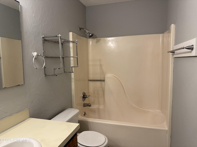 full bathroom featuring a textured wall, toilet, vanity, a textured ceiling, and shower / bathtub combination