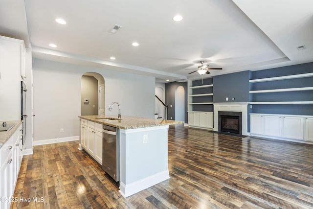 kitchen featuring arched walkways, a sink, a ceiling fan, appliances with stainless steel finishes, and recessed lighting